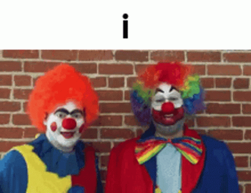Two Clowns Standing Next To Brick Wall GIF