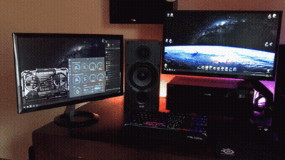 Two Computer Monitors And A Keyboard On A Desk With A Mouse Pad That Says ' Steelseries ' On It GIF
