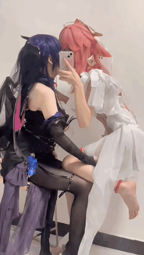 Two Cosplay Women Taking Selfie GIF