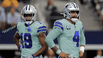 Two Cowboys Players Standing With Seafoam Background GIF
