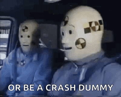 Two Crash Test Dummies Sitting In Car Saying Or Be A Crash Dummy GIF