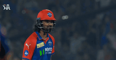 Two Cricket Players Standing Next To Each Other GIF