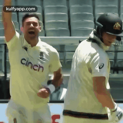 Two Cricket Players Standing On Field GIF