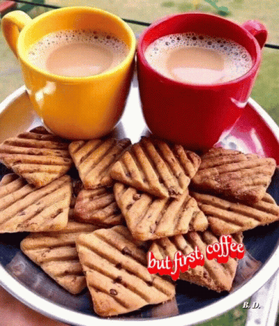 Two Cups Of Coffee And A Plate Of Cookies With The Words But First Coffee Written On It GIF