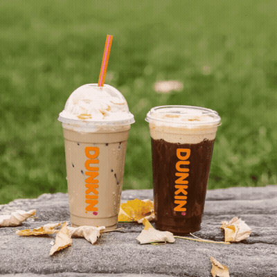Two Cups Of Dunkin ' Coffee Are On A Table GIF