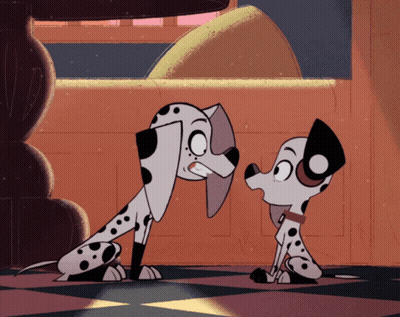 Two Dalmatian Dogs Standing Together GIF