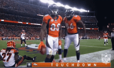 Two Denver Broncos Players Celebrating Touchdown GIF