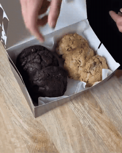 Two Different Types Cookies In Box On Wooden Table GIF