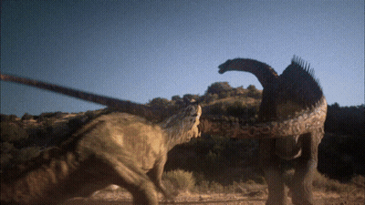 Two Dinosaurs Beside Trees GIF