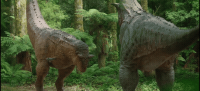 Two Dinosaurs Standing In Forest GIF