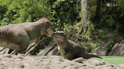 Two Dinosaurs Standing In River GIF