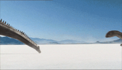 Two Dinosaurs Walking Across Desert GIF