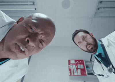 Two Doctors Looking Up At Camera With Red Box GIF