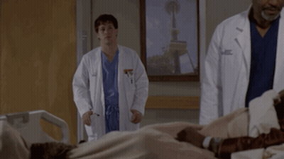 Two Doctors Standing Next To Patient In Hospital Bed With Seattle Picture GIF