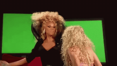 Two Drag Queens Dancing On Stage GIF