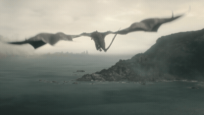 Two Dragons Are Flying Over A Body Of Water With Mountains In The Background GIF