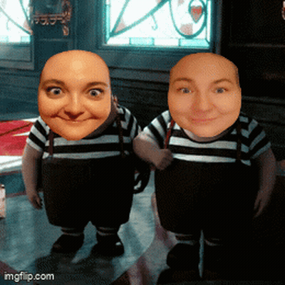 Two Dwarfs With Faces On Table GIF