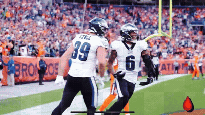 Two Eagles Football Players Celebrating Touchdown GIF