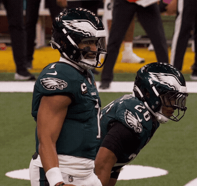 Two Eagles Football Players Number 1 And 50 GIF