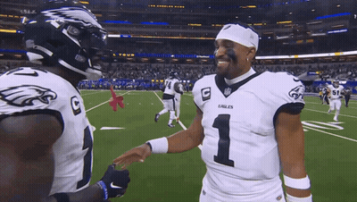 Two Eagles Football Players Shaking Hands GIF