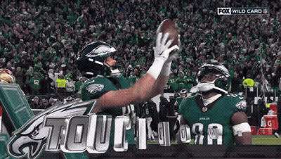 Two Eagles Players Are Celebrating A Touchdown On A Fox Wild Card Broadcast GIF