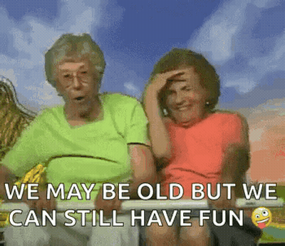 Two Elderly Women Are Sitting Next To Each Other On A Bench With The Caption `` We May Be Old But We Can Still Have Fun  GIF