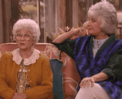 Two Elderly Women Sitting On A Couch GIF
