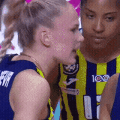 Two Female Basketball Players Are Talking To Each Other And One Of Them Has The Number 11 On Her Jersey GIF