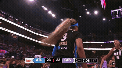 Two Female Basketball Players in Black ATL 5 Jerseys