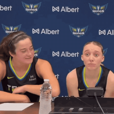 Two Female Basketball Players In Front Of Albert Wall GIF