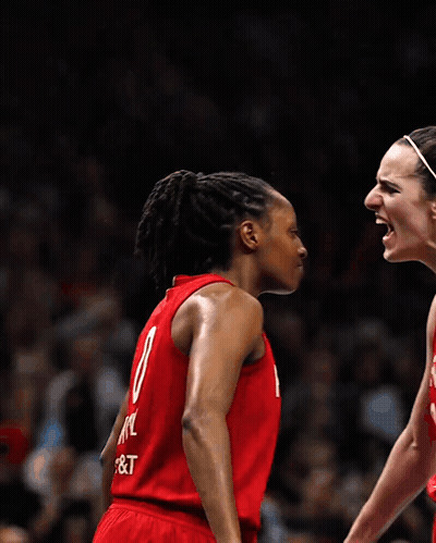 Two Female Basketball Players Wearing Red Uniforms With The Number 8 On The Back GIF