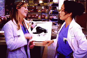 Two Female Doctors Are Standing Next To Each Other And One Of Them Has A Name Tag That Says ' Elizabeth ' GIF