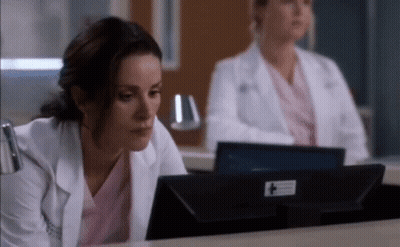 Two Female Doctors Looking At Computer Monitor GIF