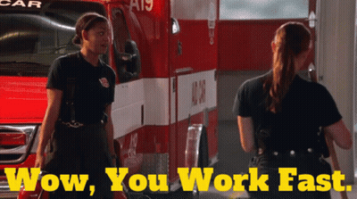 Two Female Firefighters In Front Of Ambulance GIF