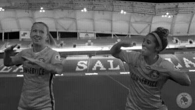 Two Female Soccer Players Dancing In Stadium GIF