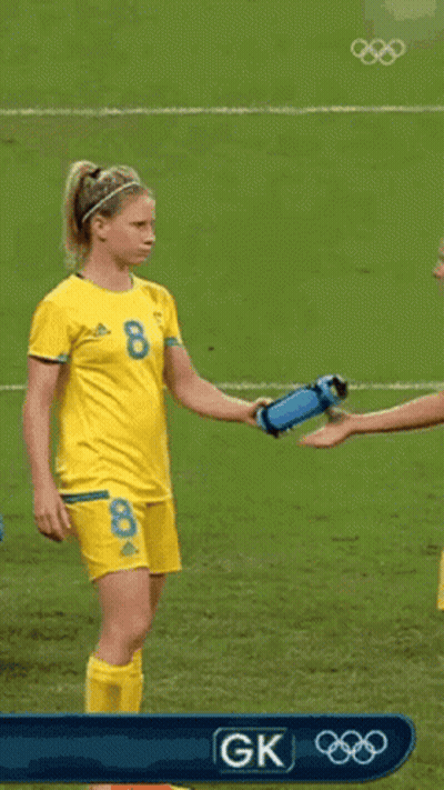 Two Female Soccer Players Drinking Water From Bottles GIF