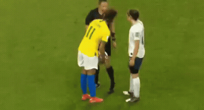 Two Female Soccer Players Talking On Field GIF