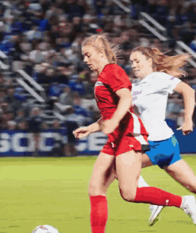 Two Female Soccer Players With Socce Sign GIF