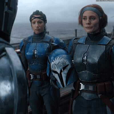 Two Female Soldiers, One Wearing Helmet GIF
