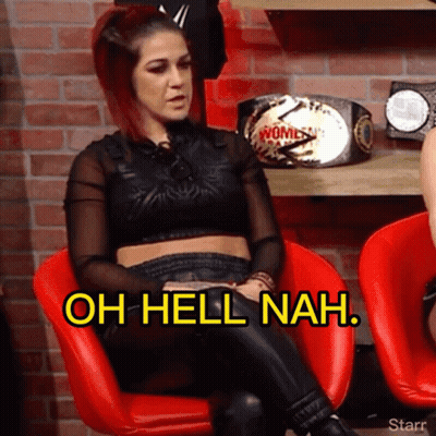 Two Female Wrestlers Holding Belts In Ring GIF