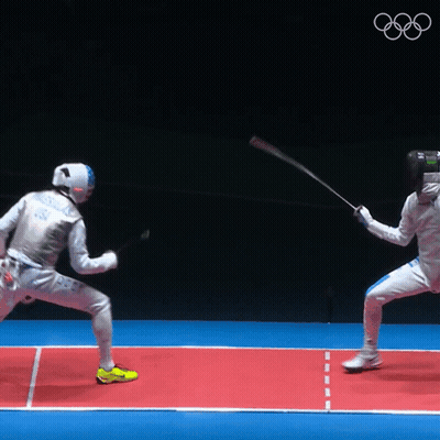 Two Fencers Are Fighting On A Red Court With The Olympics Logo In The Background GIF