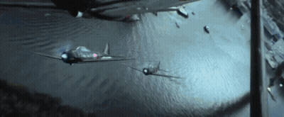 Two Fighter Jets Are Flying Over A Body Of Water At Night GIF