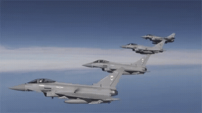 Two Fighter Jets Flying With Number 7 GIF