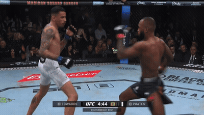 Two Fighters Are Fighting In A Ufc Ring And One Of Them Is Wearing White Shorts GIF