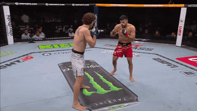 Two Fighters In A Ring With A Monster Energy Drink On The Floor GIF
