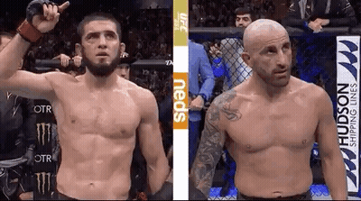 Two Fighters Standing In A Cage GIF