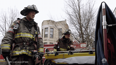 Two Firefighters Next To Stretcher Saying Chicagofire GIF