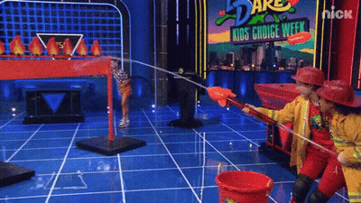 Two Firefighters Playing Game On Nickelodeon Kids Choice Week GIF