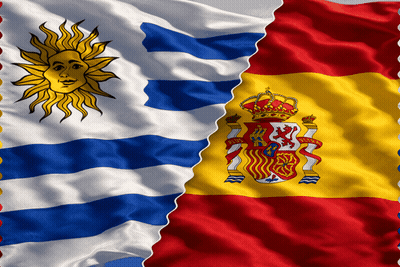 Two Flags One From Uruguay And The Other From Spain Are Waving In The Wind GIF