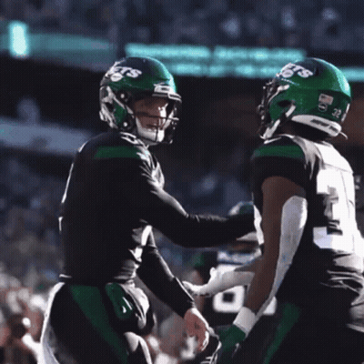 Two Football Players Carter And Wilson Hugging GIF